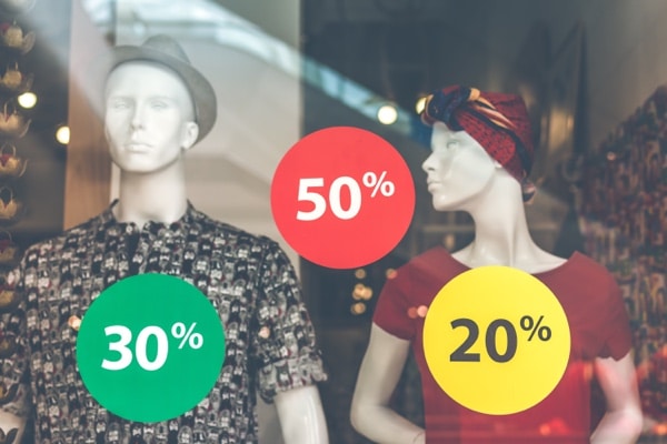 an image of a retail store with dummies and different discount numbers to increase conversions.