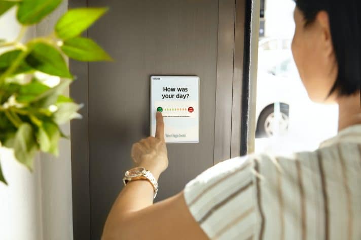 An image of a customer answering a survey question on how was their day