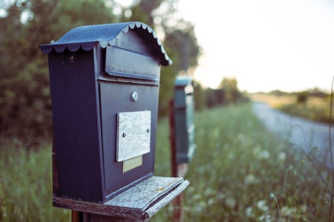 an image of a postal box on the road that belongs to an individual signaling message personalization