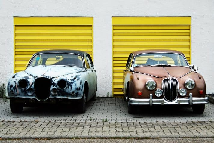 An image of a beatdown car and brand new car depicting doing conversion optimisation yourself or getting an agency to do it.