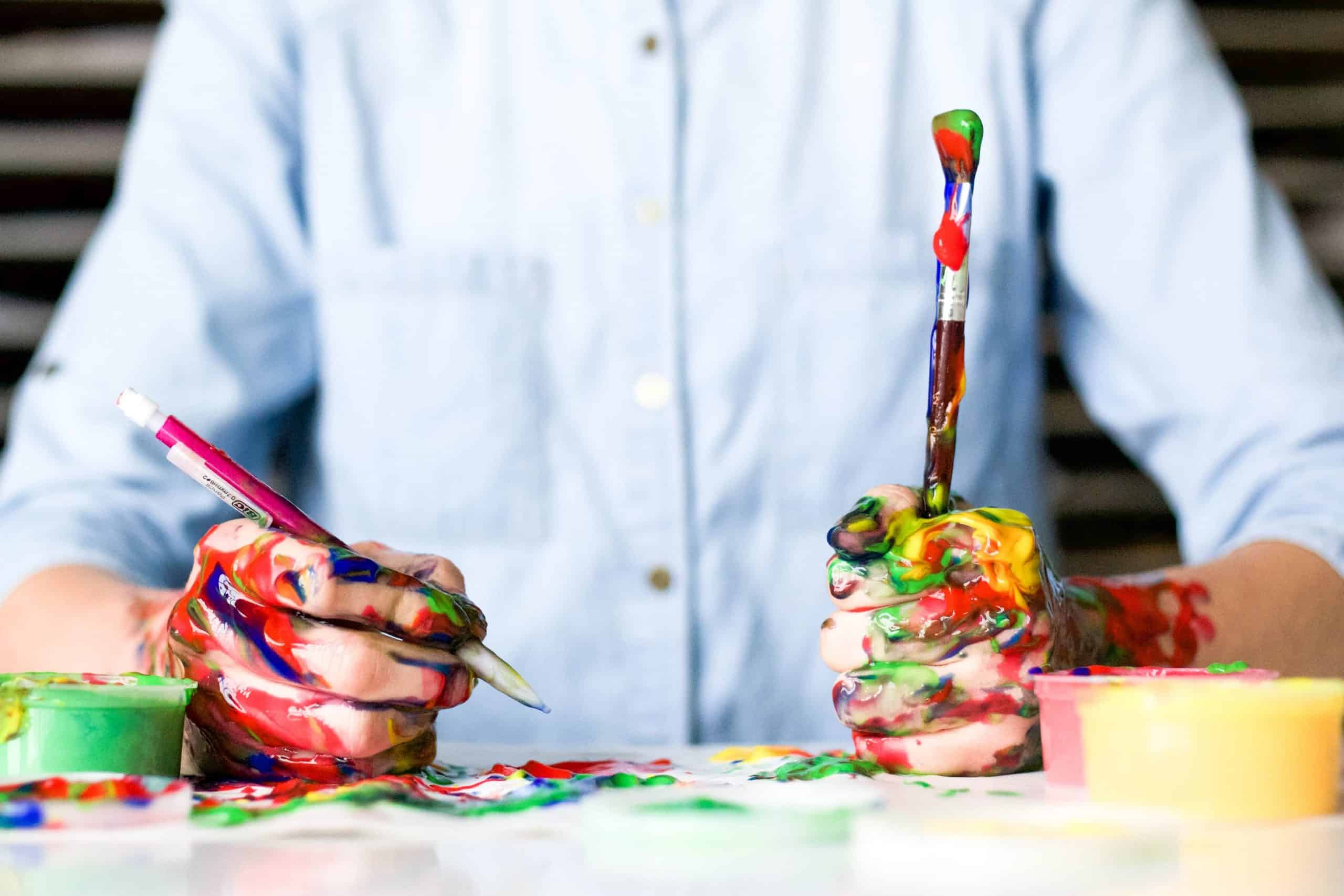 an image of an artist trying to come up with a visually appealing painting signifying copywriting persuasion that motivates the reader to take a desired action.