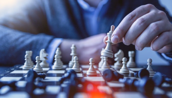 an image of a chess player making a move depicting how CRO experts make decisions on client projects