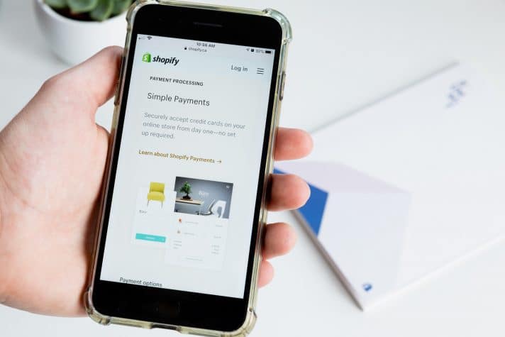 An image of a shopify screen on a mobile device and the ways conversion optimization can help improve the product page
