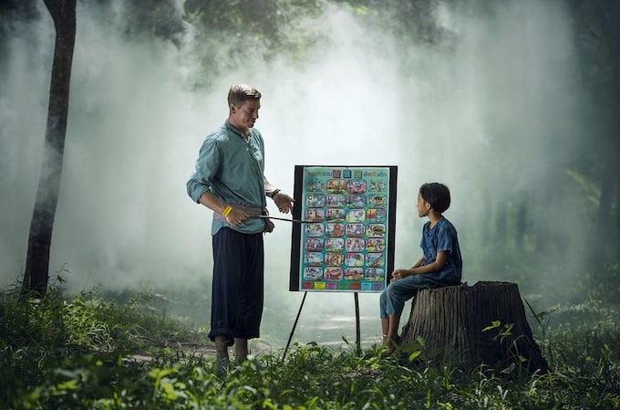 an image of a father teaching his son depicting entrepreneurship lessons being passed down